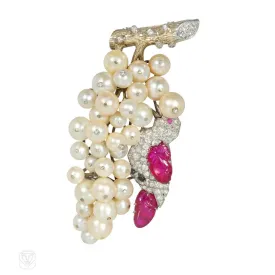 Sure, heres an optimized title for the product:
Stunning 1930s J.E. Caldwell Ruby, Diamond, and Pearl Grape Cluster Brooch