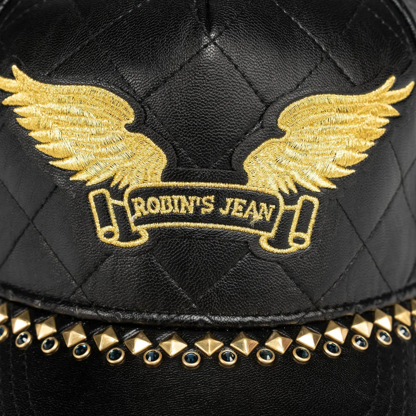 ROBINS LEATHER QUILTED CAP WITH GOLD WINGS STUDS AND CRYSTALS IN BLACK